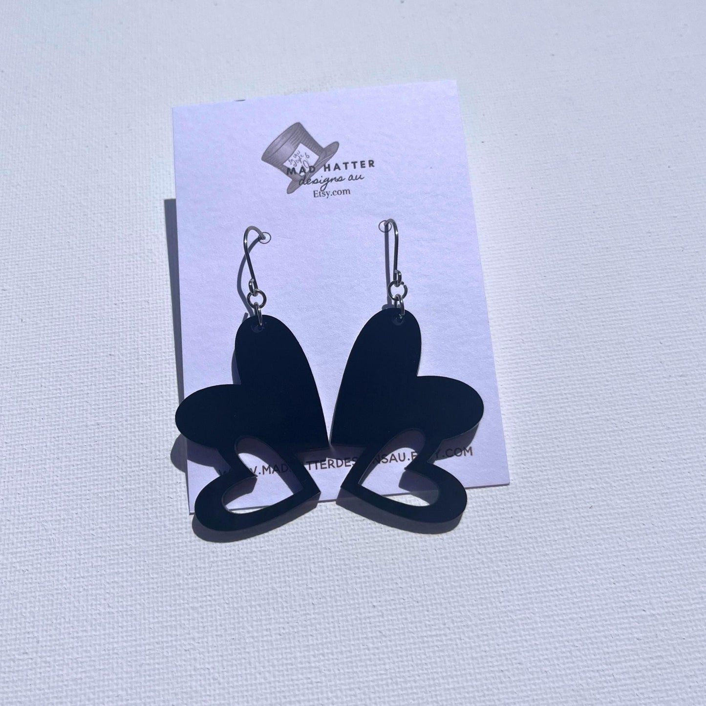 Black double-heart dangle earrings