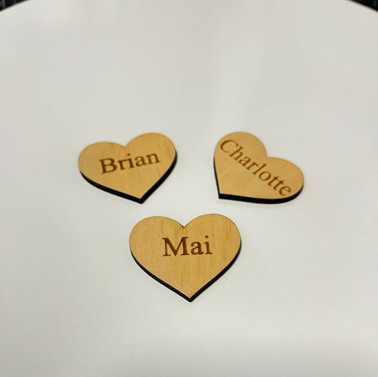 Custom family tree additions wooden heart-shaped tags engraved with names Brian Charlotte and Mai