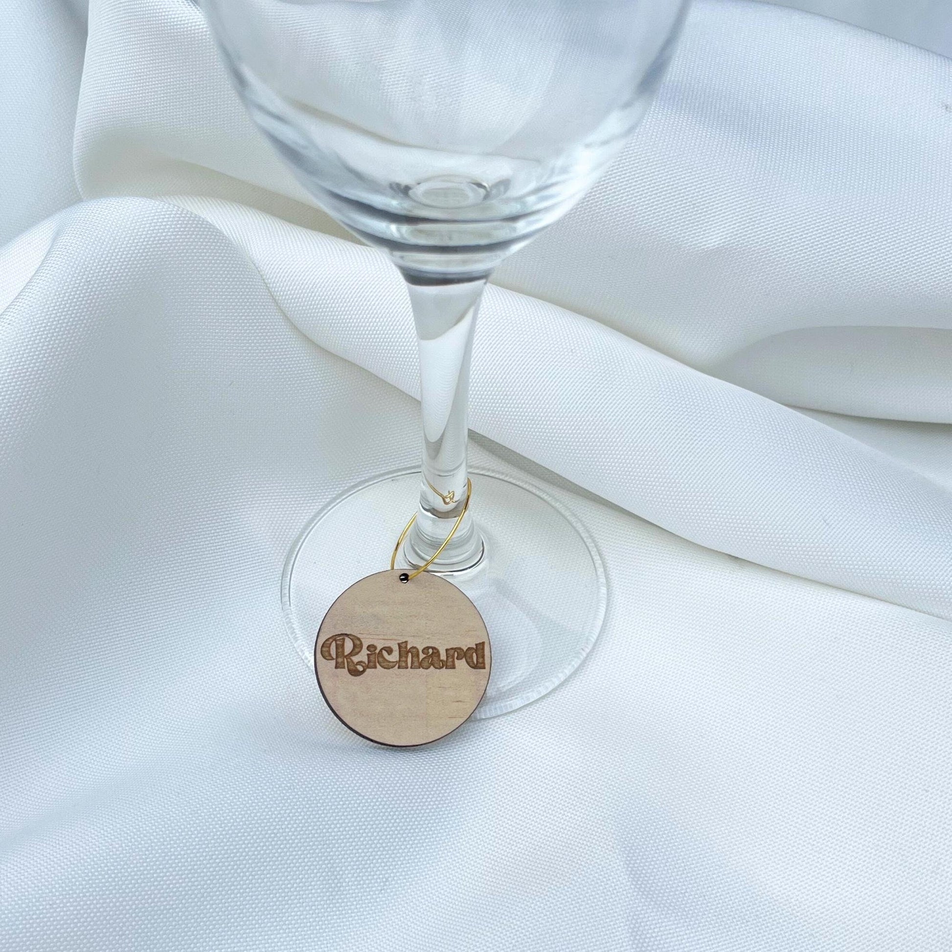 Personalized wine charms wooden tag engraved with name Richard attached to wine glass stem